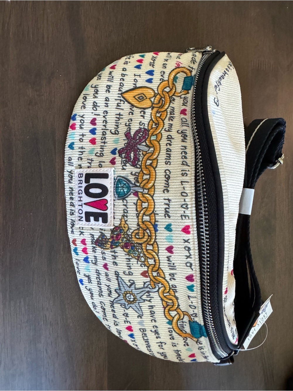 Brighton Cream Crossbody with Multicolor Love Print and Gold Chain Motif
